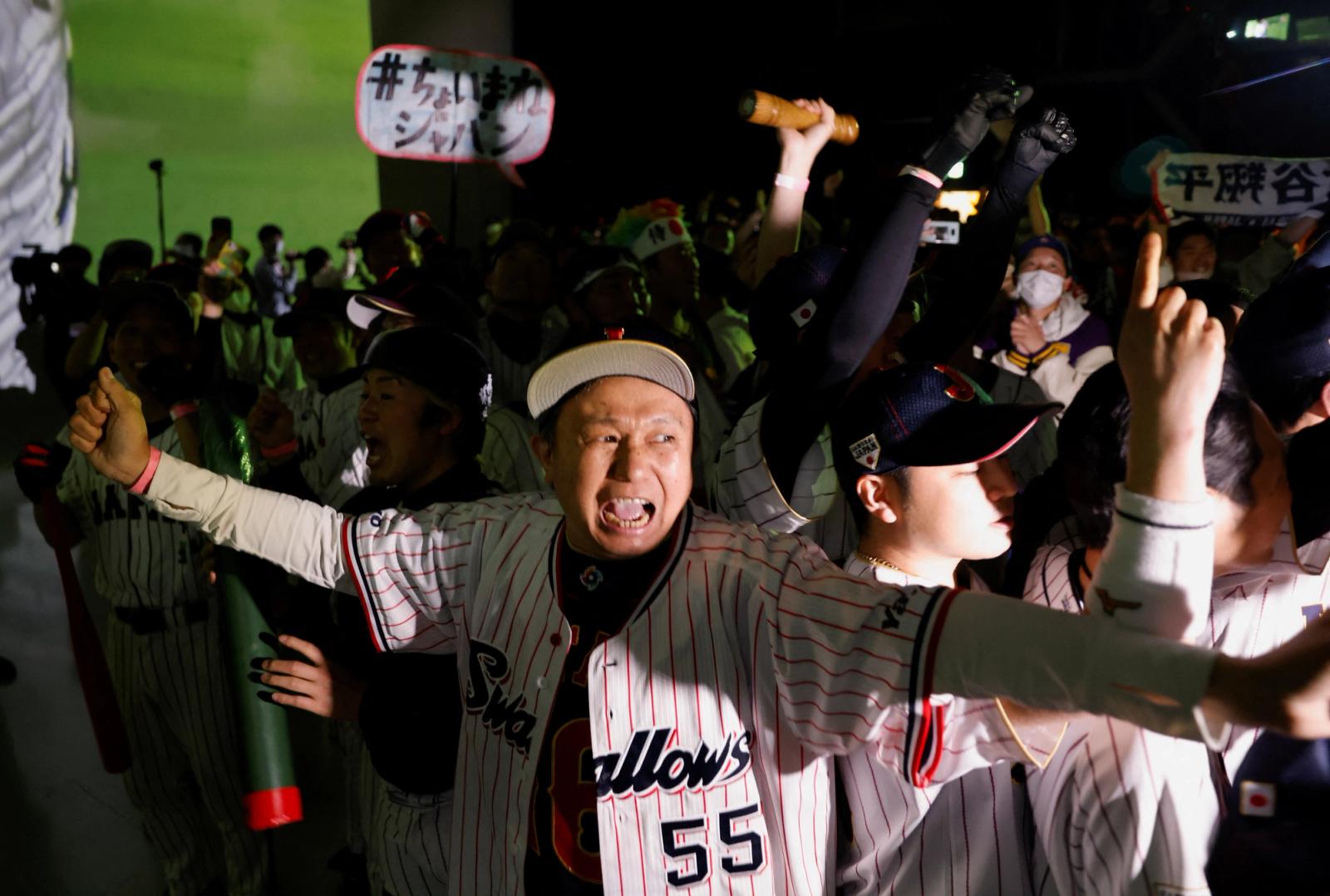 Fans react after Japan won the World Baseball Classic final game against the United States, in Tokyo, Japan March 22, 2023. REUTERS/Issei Kato
