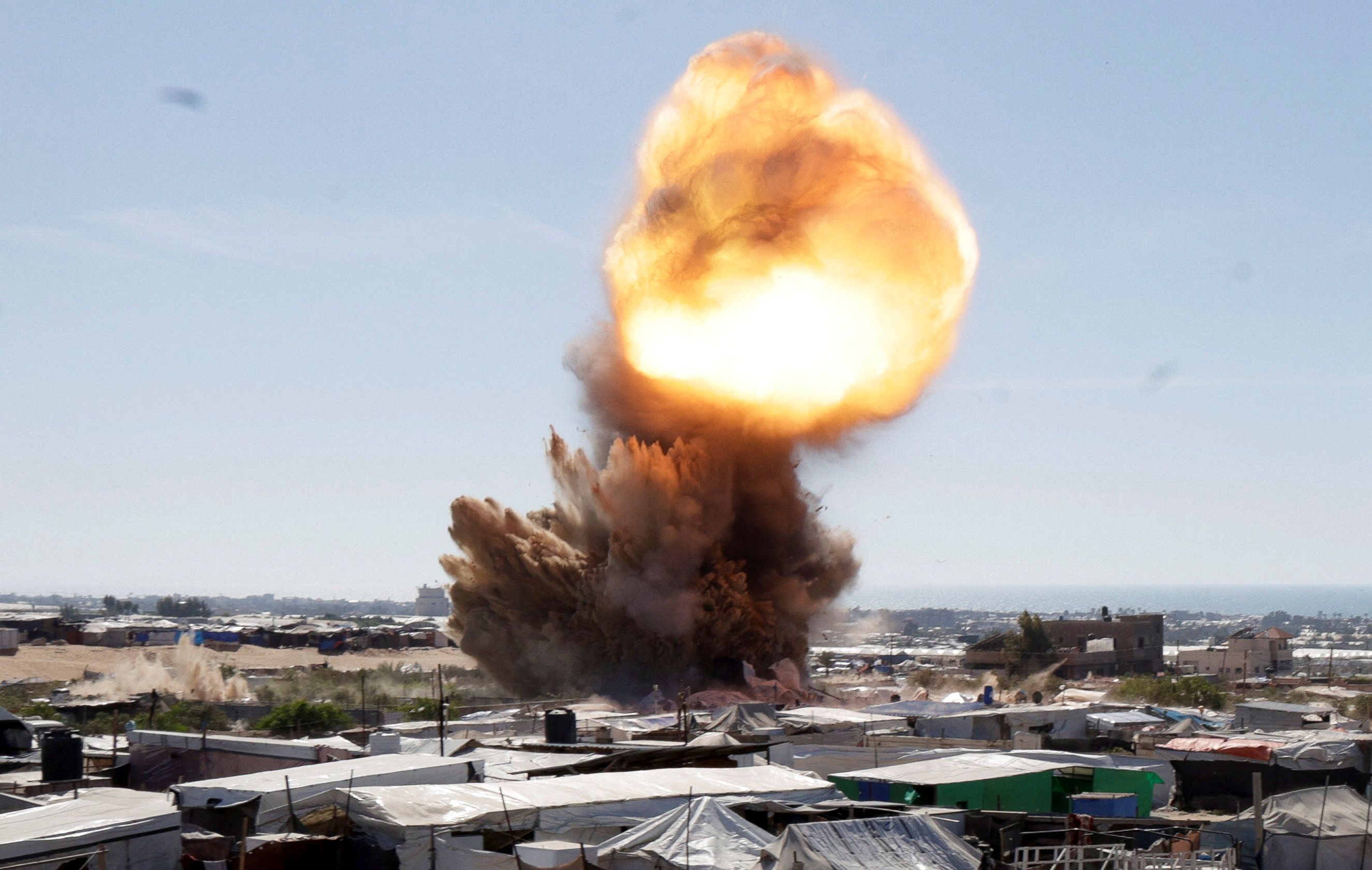 A view shows an explosion during an Israeli strike at a tent camp sheltering displaced people, in Khan Younis, southern Gaza Strip, April 19, 2025.