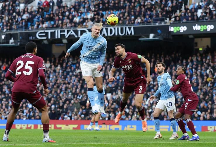 Haaland heading a ball.