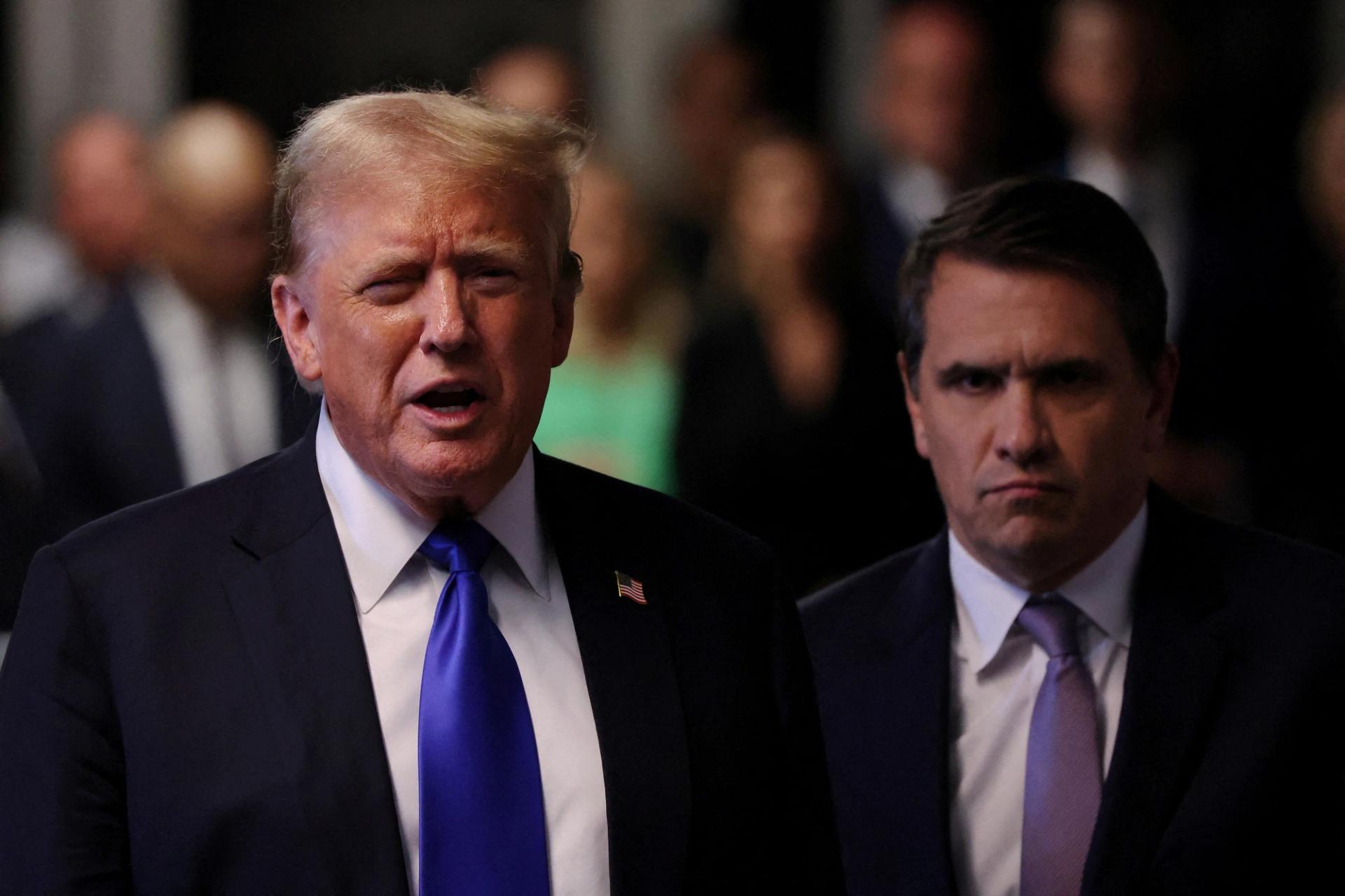 Former U.S. President Donald Trump gives brief remarks alongside his attorney Todd Blanche after the conclusion of his hush money trial at Manhattan Criminal Court.