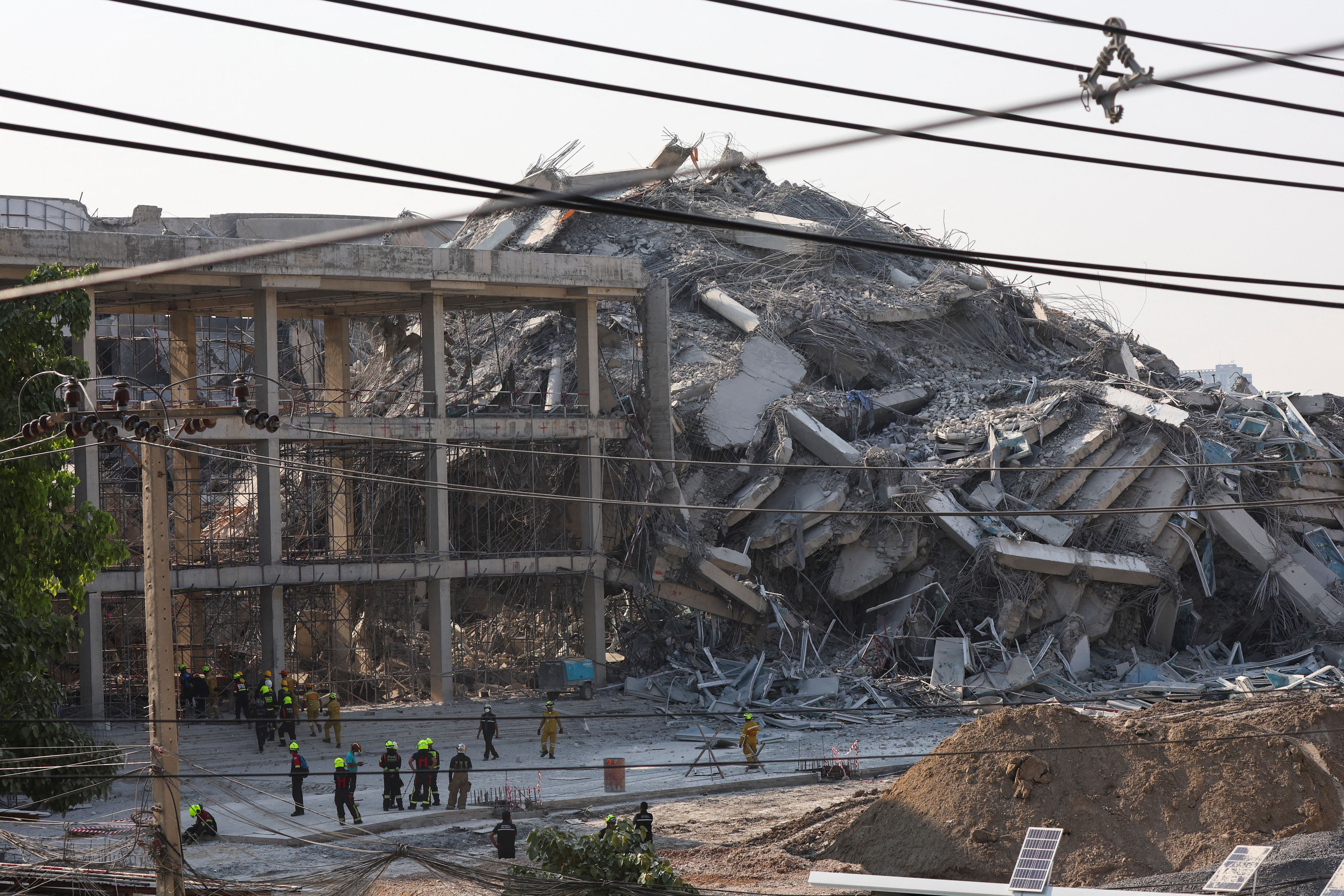 Rescue personnel near a building that collapsed in Bangkok, Thailand after an earthquake struck Myanmar.