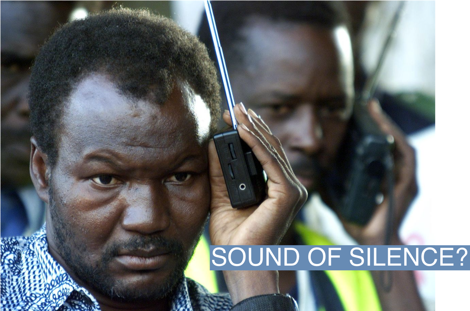 Malian soccer fans listen to radio commentary as they watch televison coverage of hosts Mali beating South Africa in the quarter final of the African Nations Cup in Bamako January 3, 2002. Mali won 2-0, sending World Cup finalists South Africa home and moving the hosts onto the semifinals