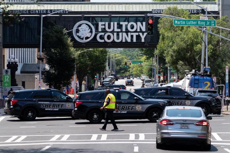 Sheriff’s vehicles and security barriers are seen around the Fulton County Courthouse.