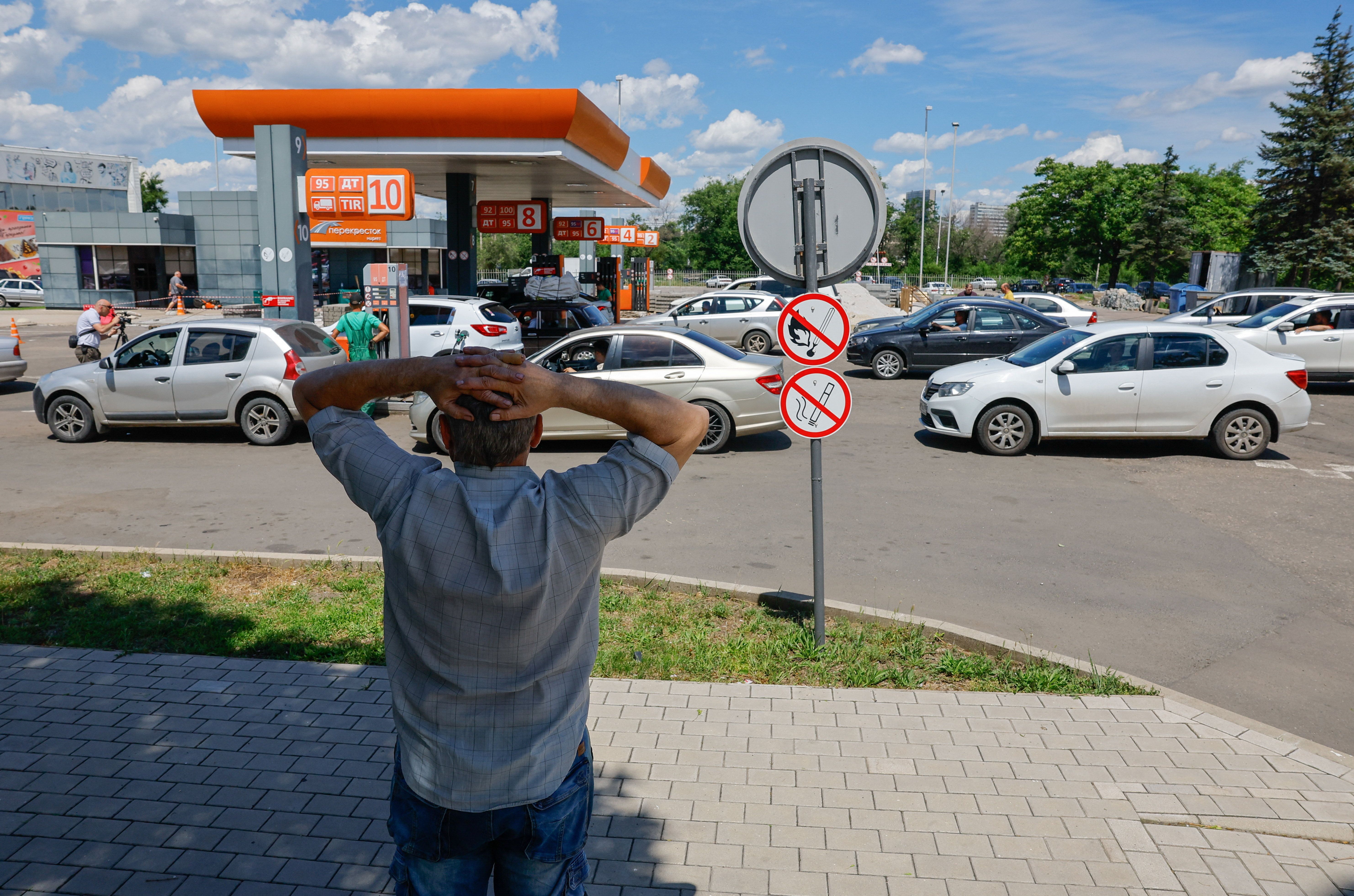 Cars queue at a gas station in Donetsk