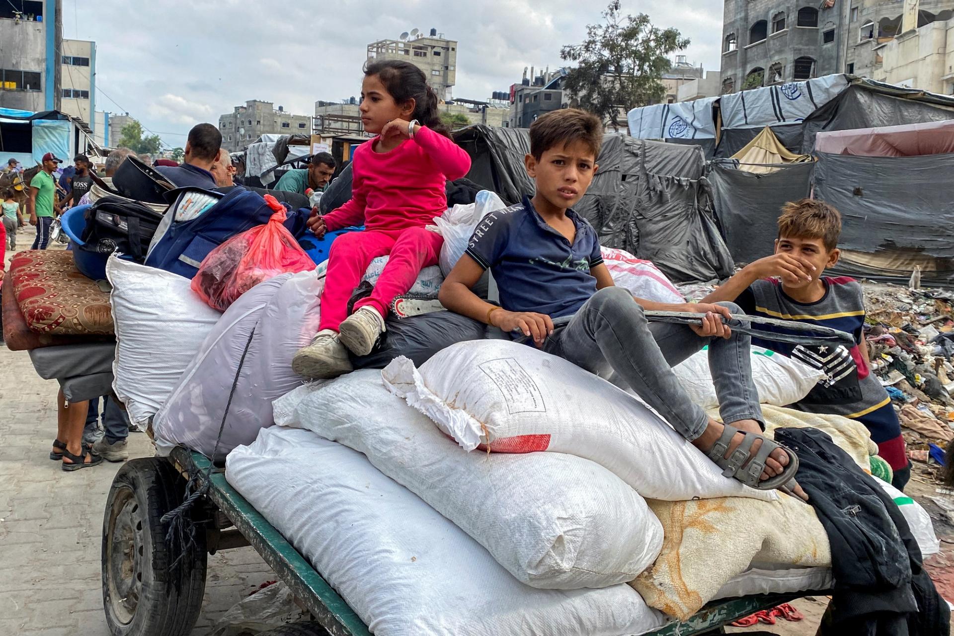 Children in a convoy in Gaza.