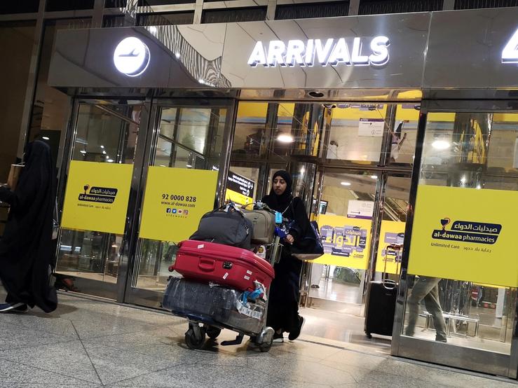 A Saudi woman is seen with her luggages as she arrives at King Fahd International Airport in Dammam, Saudi Arabia, August 21, 2019.