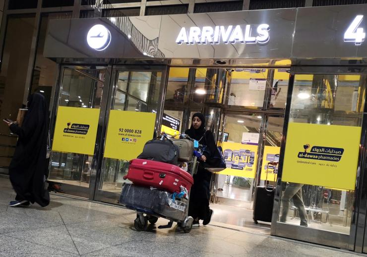 A Saudi woman is seen with her luggages as she arrives at King Fahd International Airport in Dammam, Saudi Arabia, August 21, 2019.