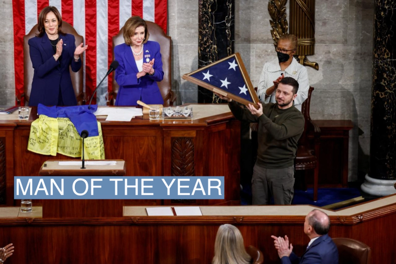 Ukraine’s President Volodymyr Zelenskiy receives a U.S. flag during a joint meeting of the U.S. Congress in the House Chamber of the U.S. Capitol in Washington, U.S., December 21, 2022.