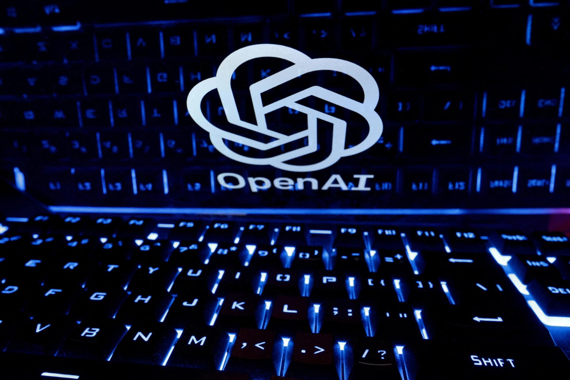 An image showing a logo of OpenAI and a laptop