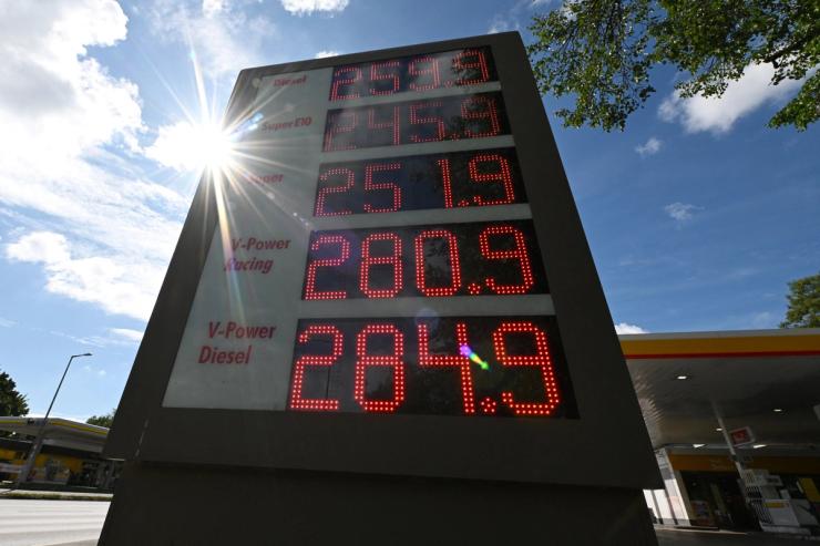 A display board showing the current prices of petrol and diesel at a gas station, in Munich, Germany.