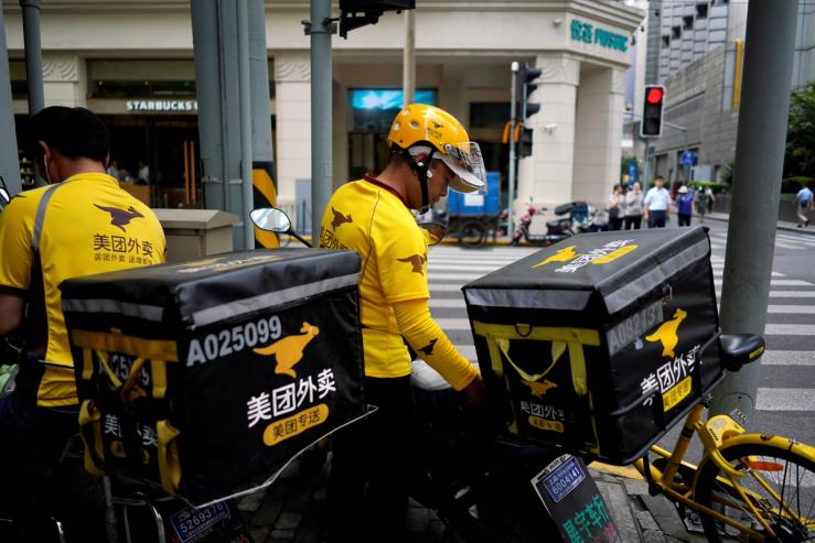 Drivers of food delivery service Meituan are seen in Shanghai, China