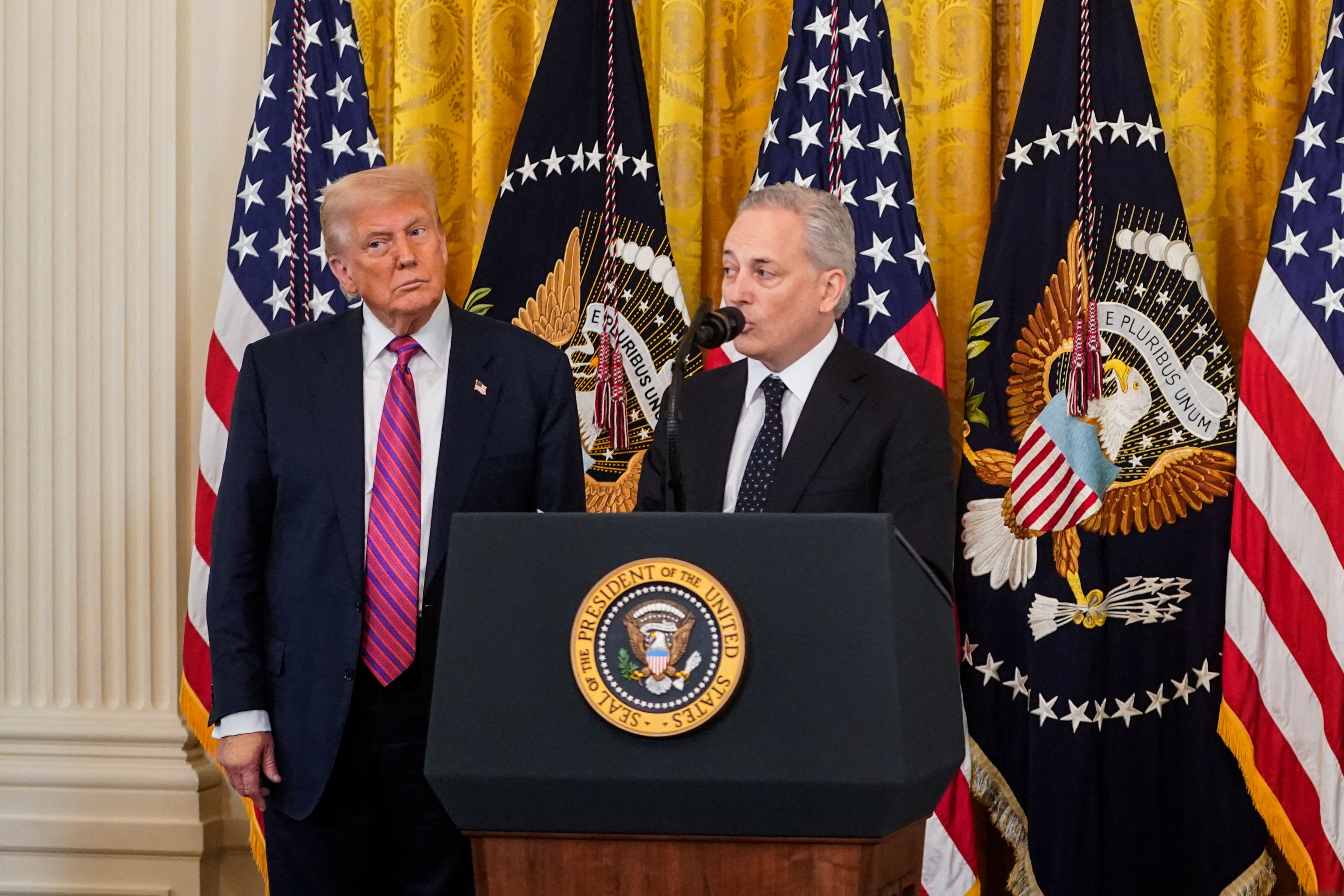 David Sacks speaks next to US President Donald Trump