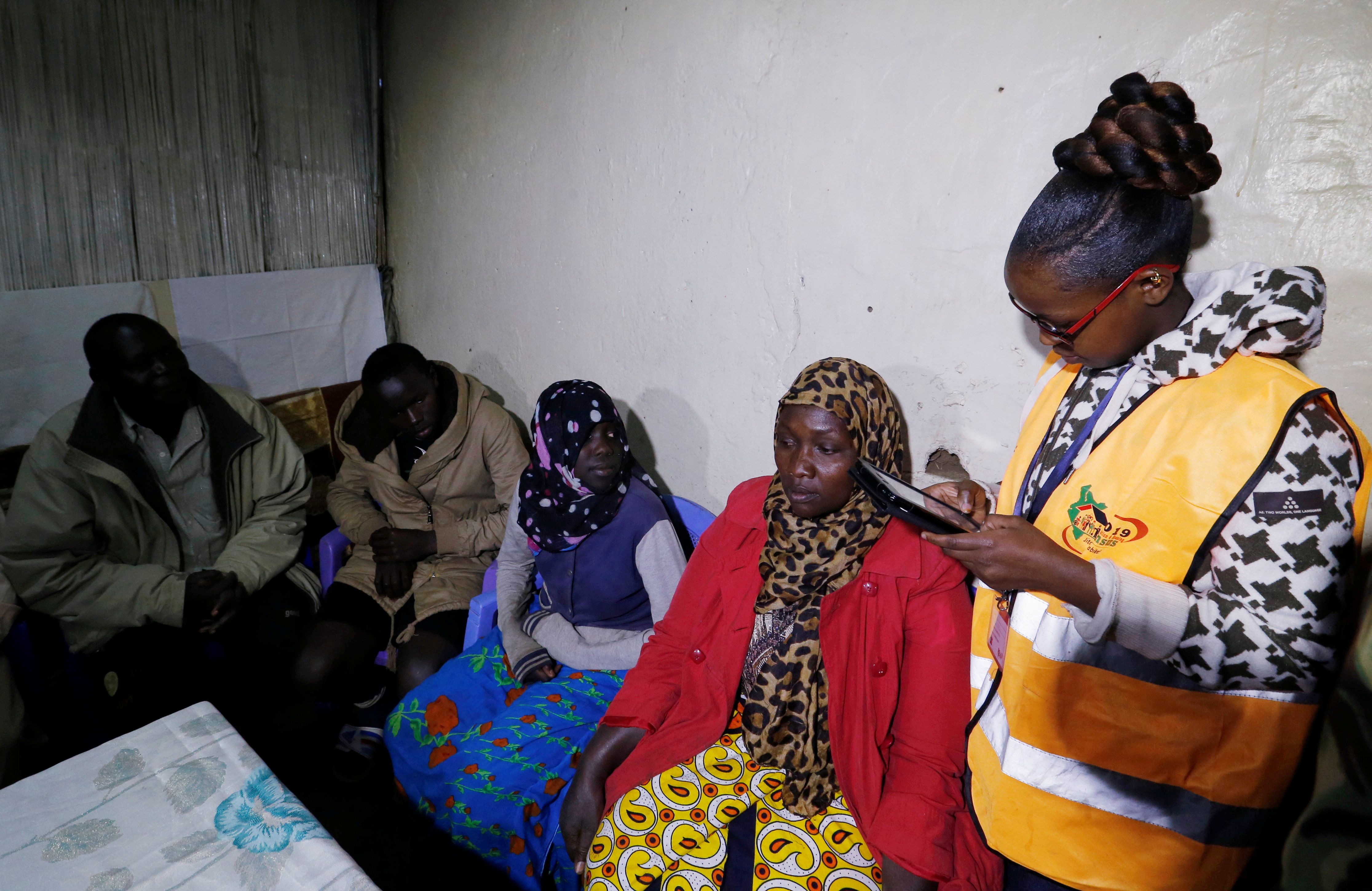 An enumerator arrives to record details of a family participating in the 2019 Kenya Population and Housing Census at the Kibera slum in Nairobi, Kenya, August 24, 2019. 
