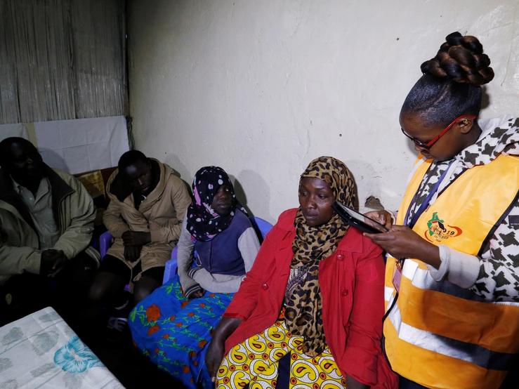 An enumerator arrives to record details of a family participating in the 2019 Kenya Population and Housing Census at the Kibera slum in Nairobi, Kenya, August 24, 2019.