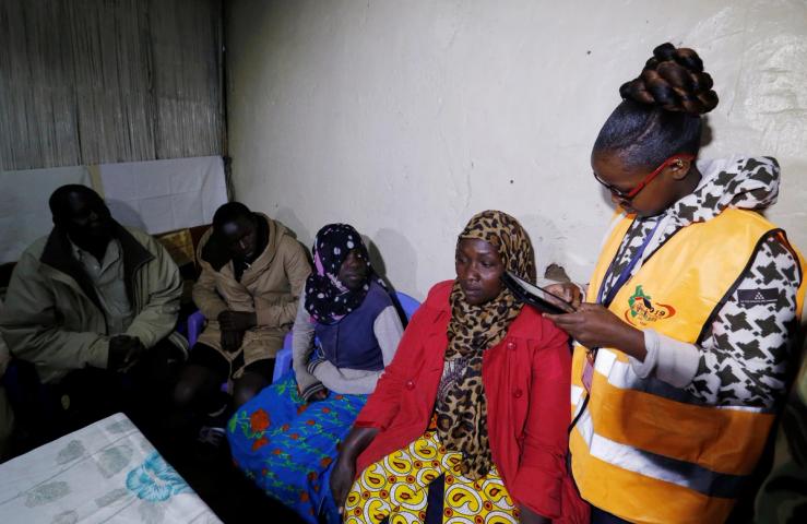An enumerator arrives to record details of a family participating in the 2019 Kenya Population and Housing Census at the Kibera slum in Nairobi, Kenya, August 24, 2019.