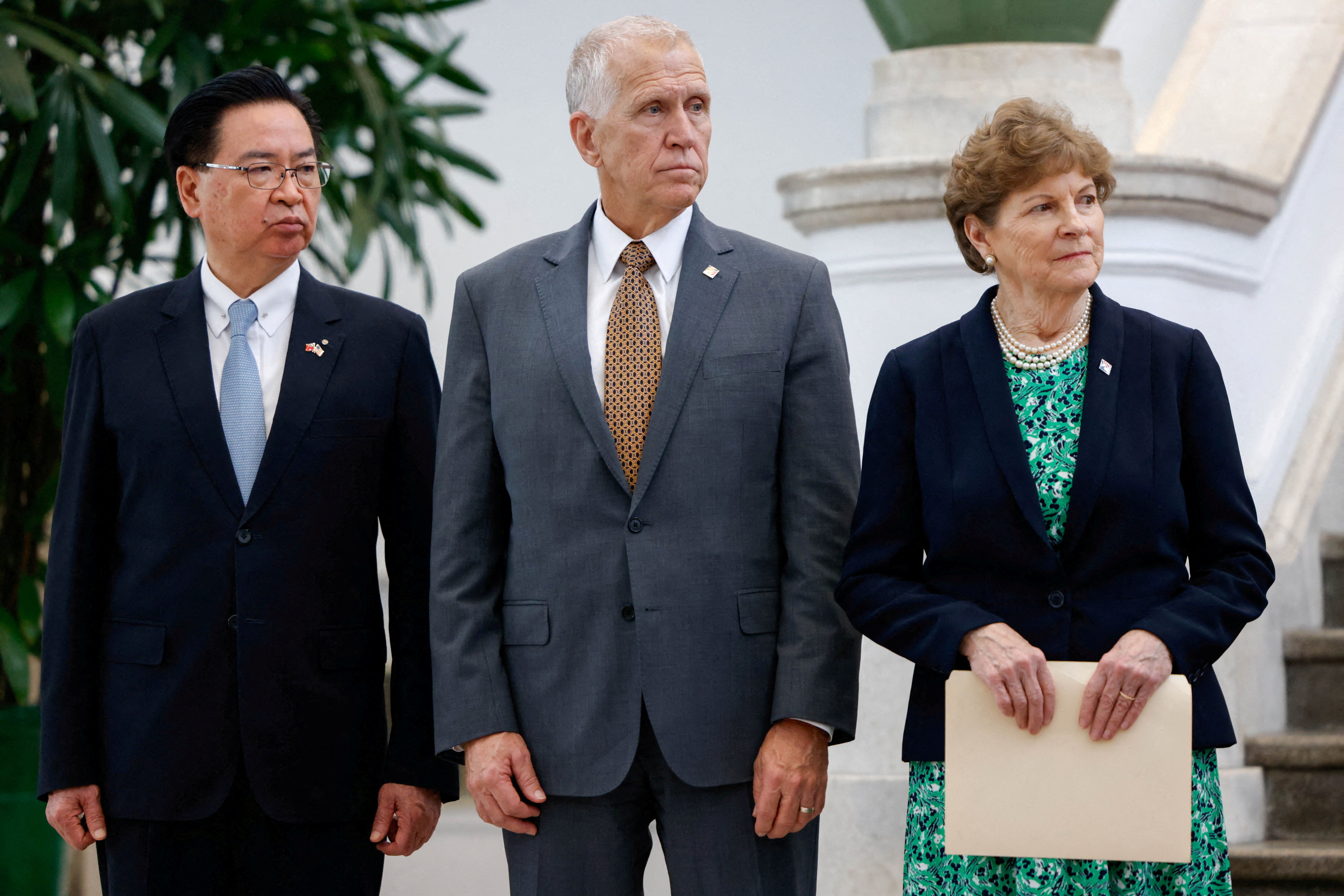 Senators Thom Tillis and Jeanne Shaheen attend a press conference at the Presidential Office Building in Taipei with Taiwan’s National Security Council Secretary-General Joseph Wu