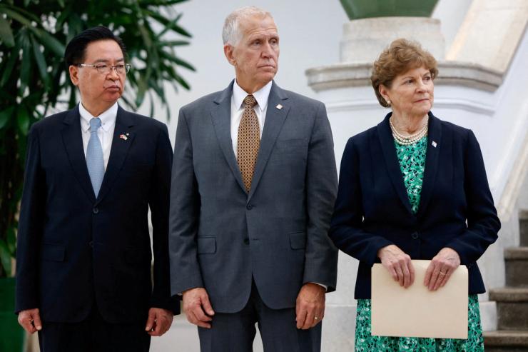 Senators Thom Tillis and Jeanne Shaheen attend a press conference at the Presidential Office Building in Taipei with Taiwan’s National Security Council Secretary-General Joseph Wu