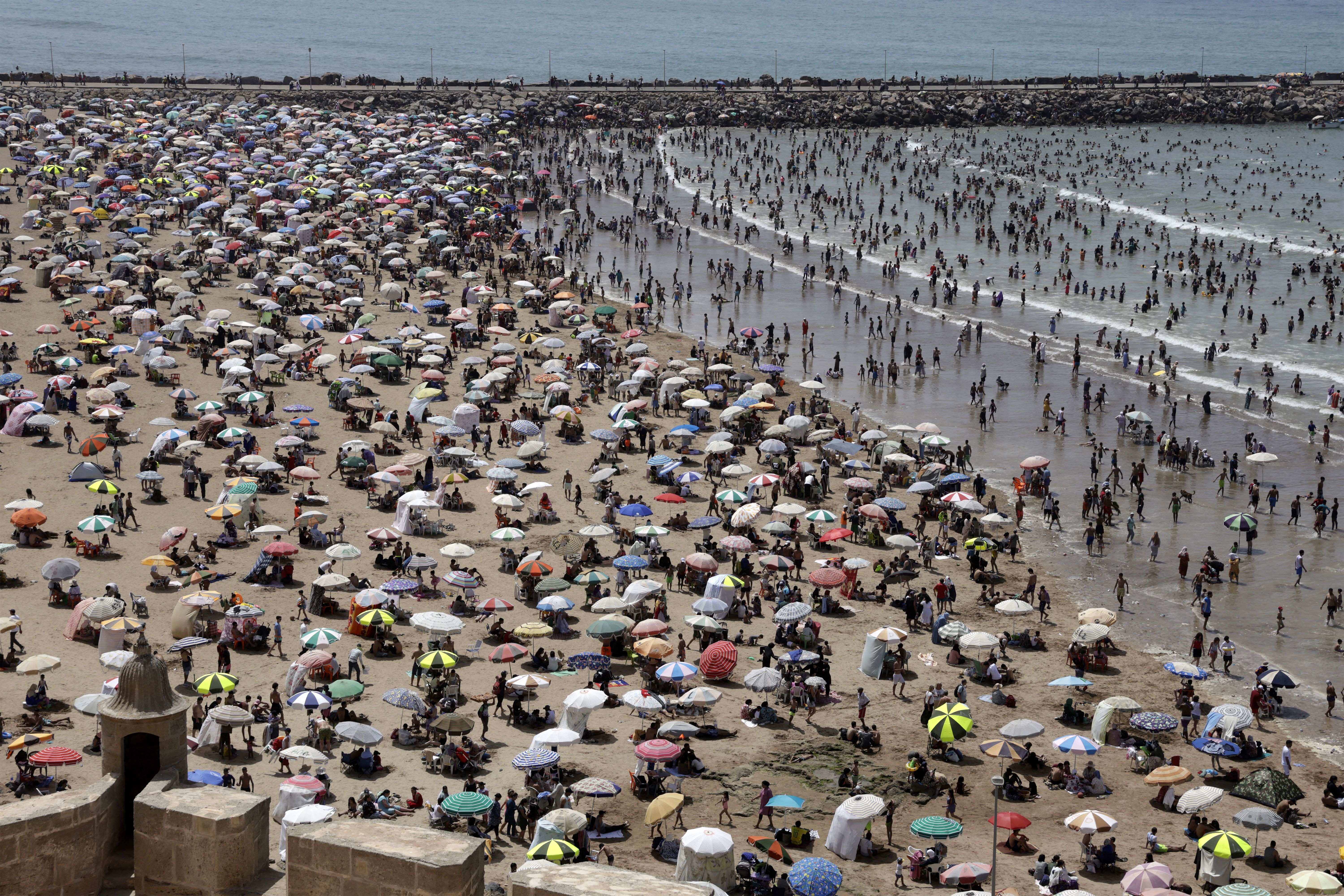 People cool off at the beach during a heat wave in Rabat, Morocco, in June.