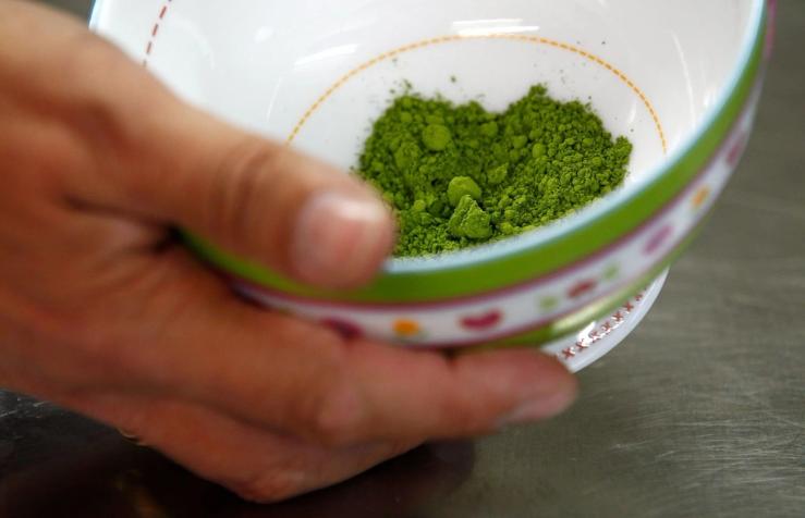 A bowl with matcha powder.