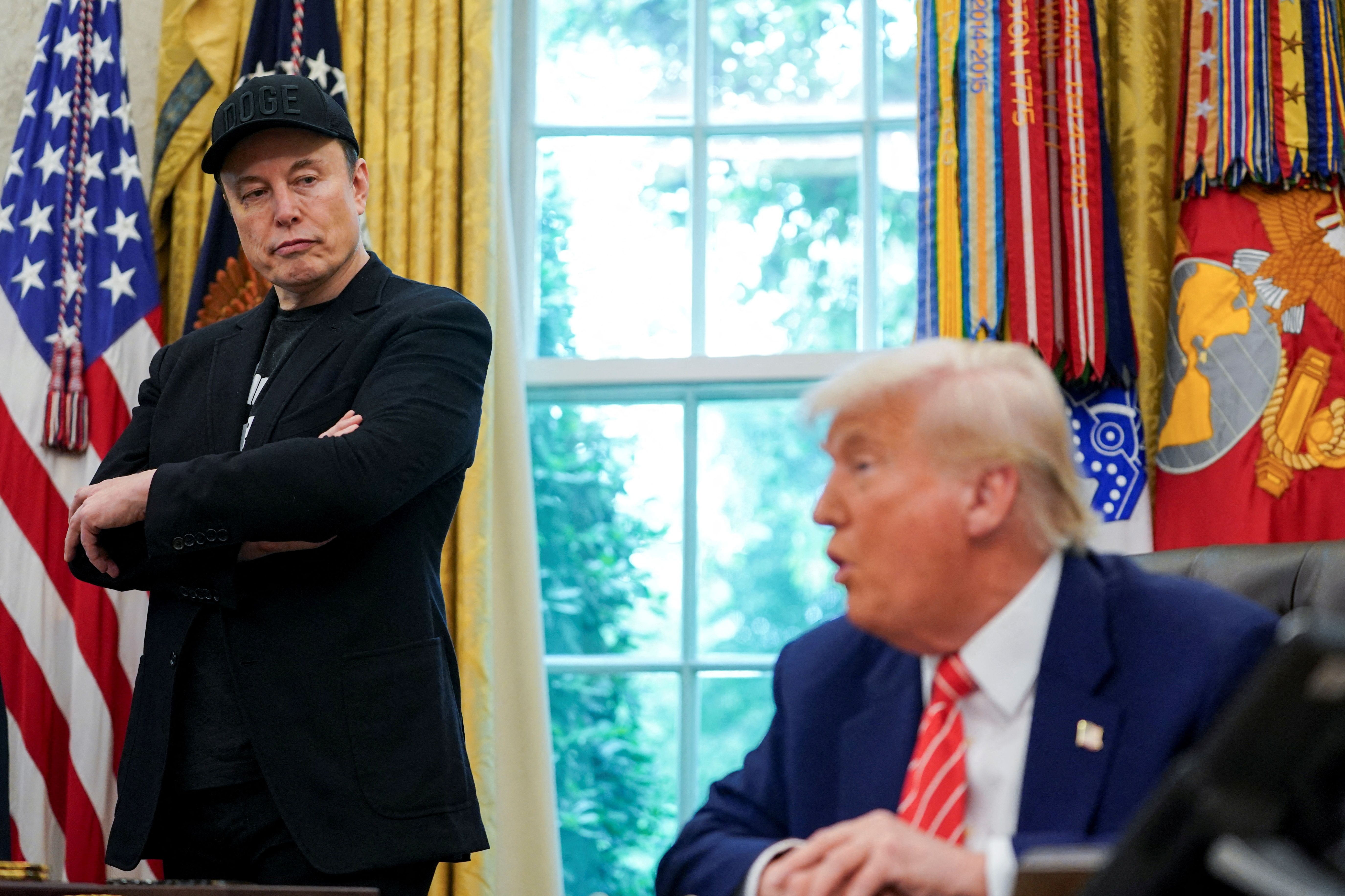US President Donald Trump and Elon Musk attend a press conference in the Oval Office.