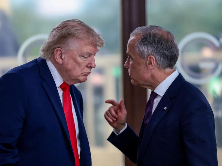 US President Donald Trump speaks with Canadian Prime Minister Mark Carney