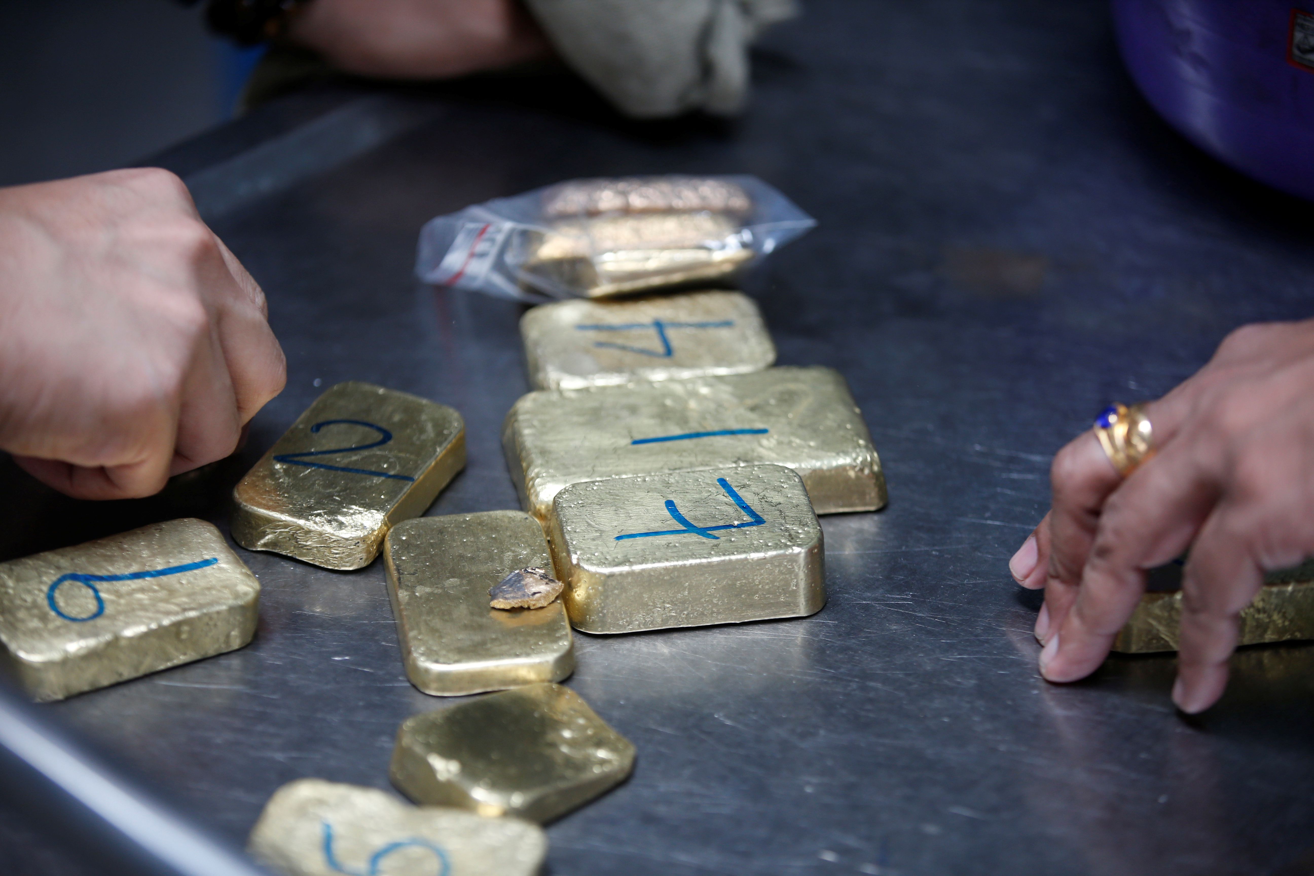 Gold bars are seen before the refining process at AGR (African Gold Refinery) in Entebbe, Uganda,