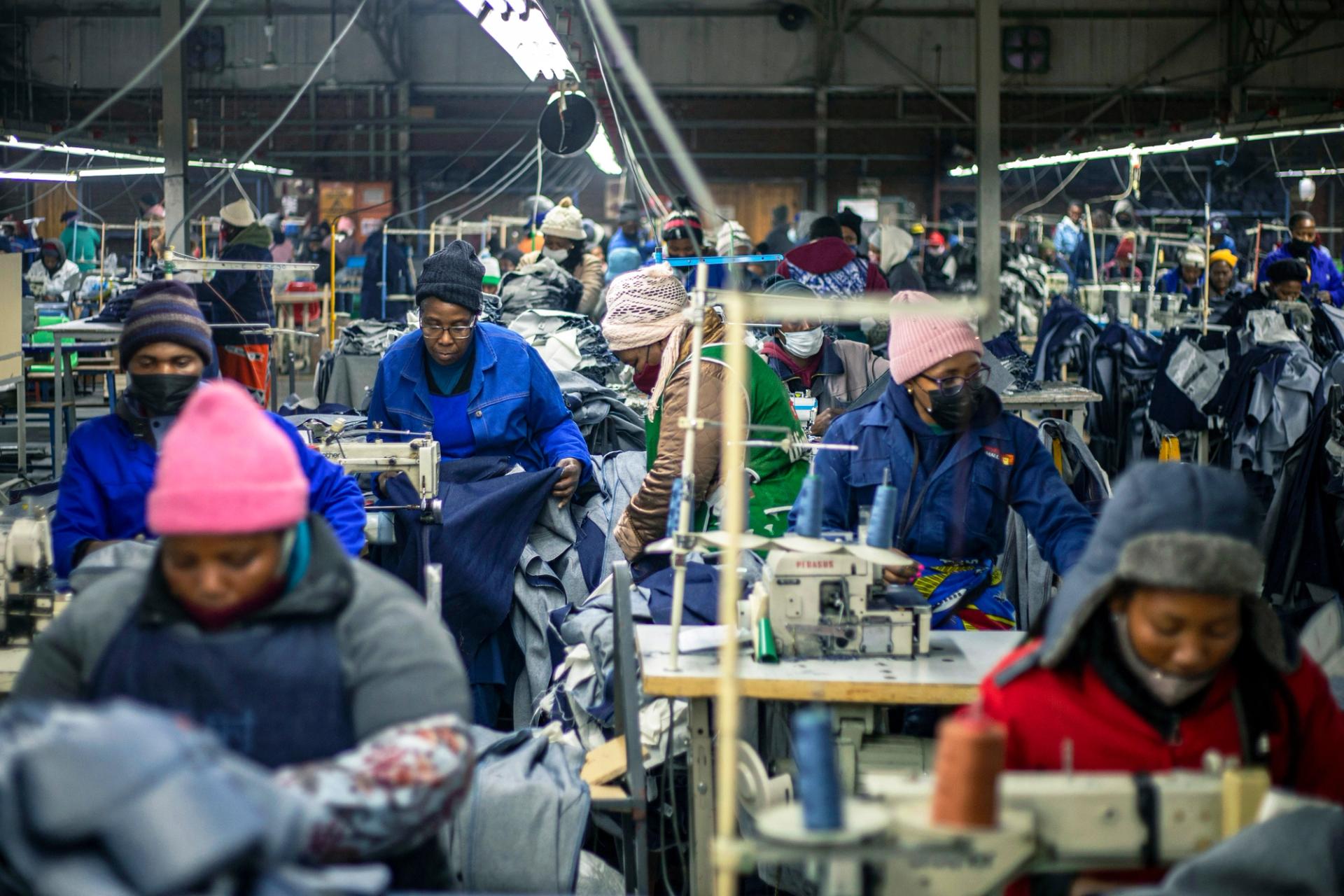 Garment factory workers operate sewing machines in Lesotho. 