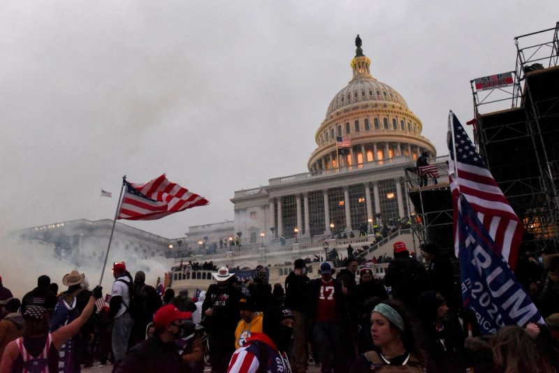 Police clear the U.S. Capitol Building with tear gas as supporters of U.S. President Donald Trump gather outside, in Washington, U.S. January 6, 2021.