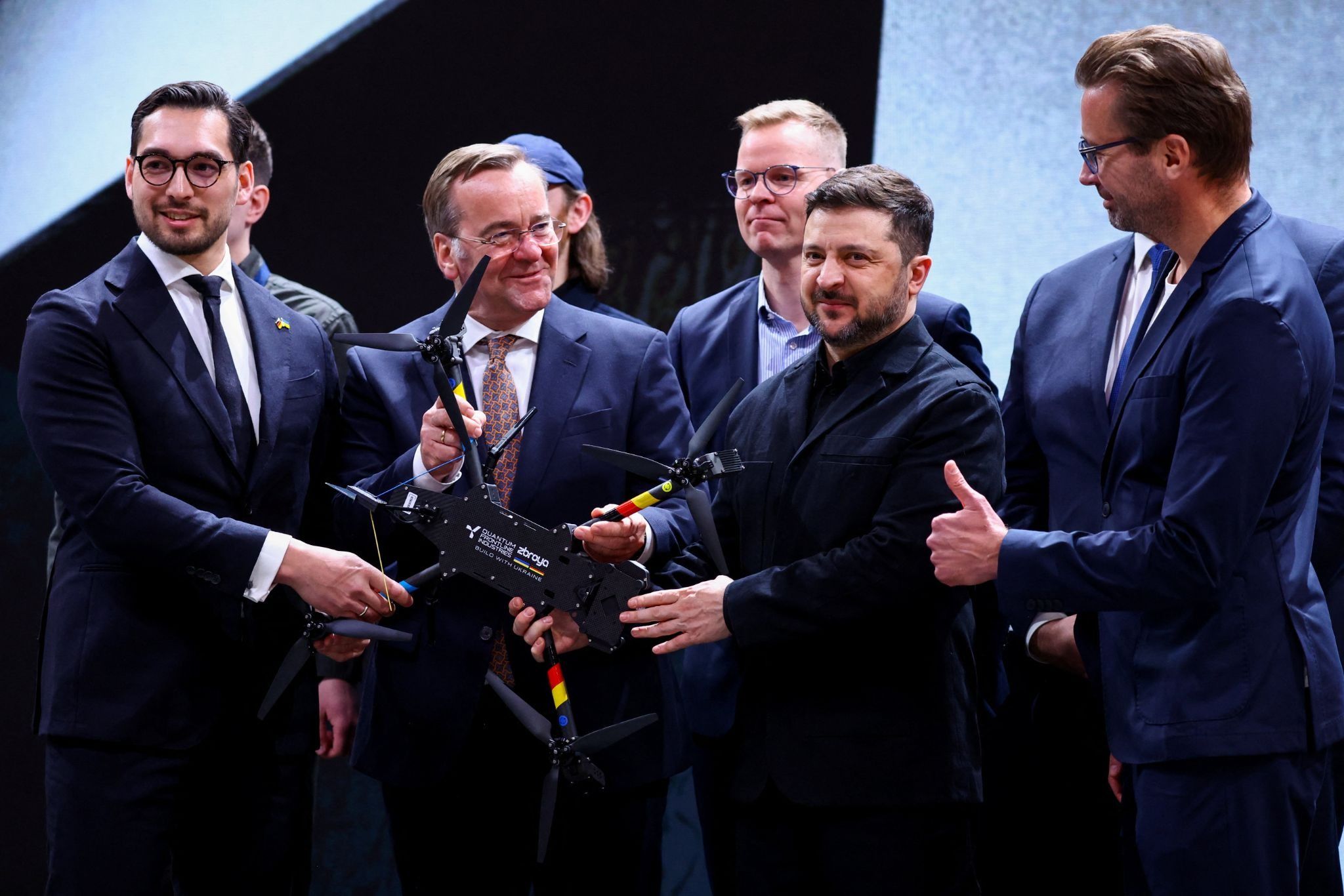 Ukraine’s Volodymyr Zelenskyy holds a jointly-made German and Ukrainian drone 