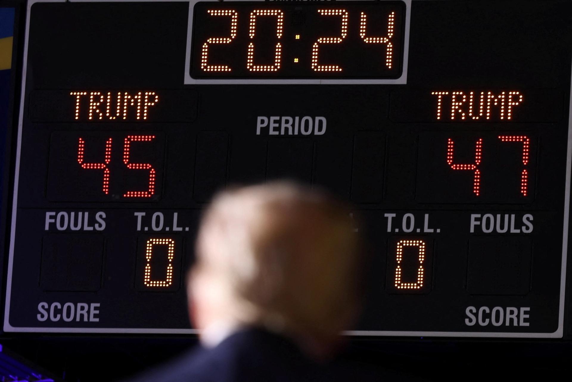 Republican presidential nominee and former U.S. President Donald Trump stands in front of a scoreboard that displays “Trump 45” and “Trump 47″, referring to Trump as the nation’s 45th president and his bid to become the 47th president, during a rally in Greensboro, North Carolina.