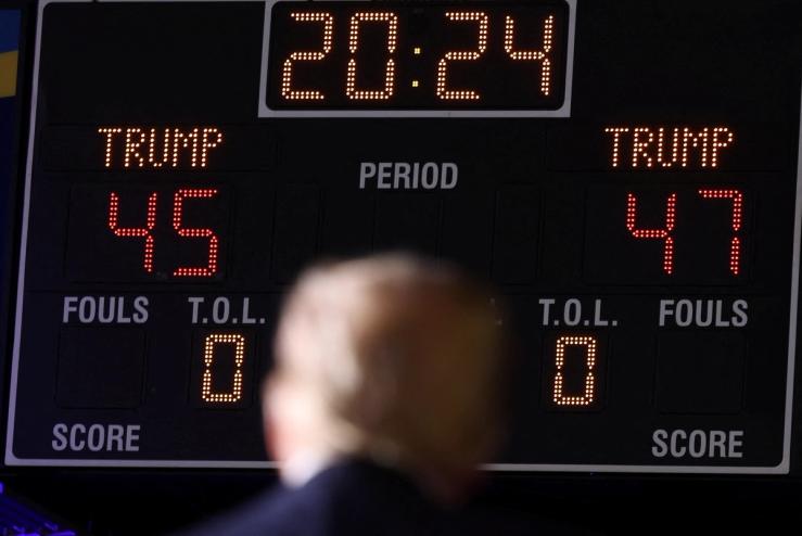 Republican presidential nominee and former U.S. President Donald Trump stands in front of a scoreboard that displays “Trump 45” and “Trump 47″, referring to Trump as the nation’s 45th president and his bid to become the 47th president, during a rally in Greensboro, North Carolina.