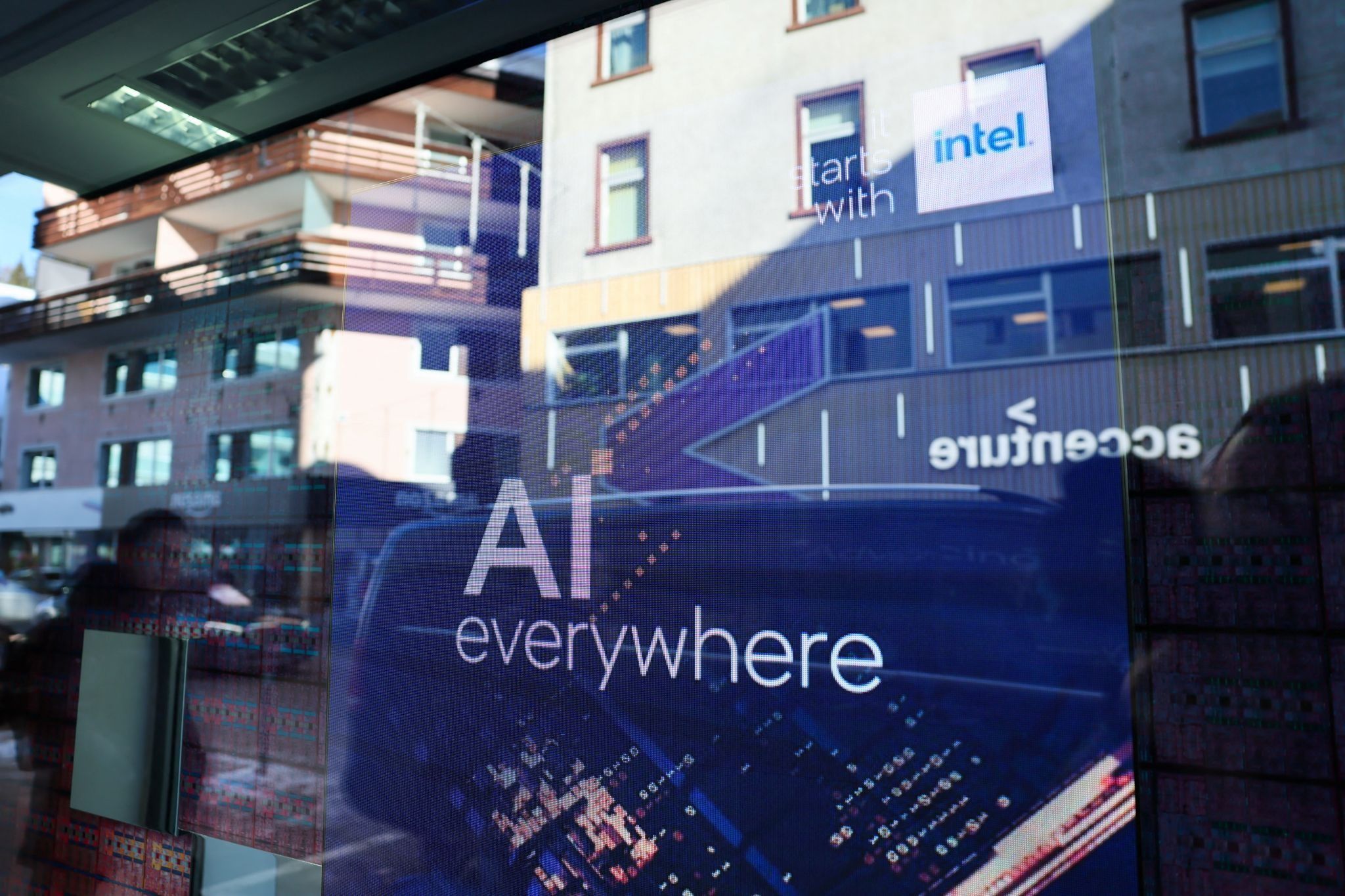 A slogan related to Artificial Intelligence (AI) is displayed on a screen in Intel pavilion, during the 54th annual meeting of the World Economic Forum in Davos