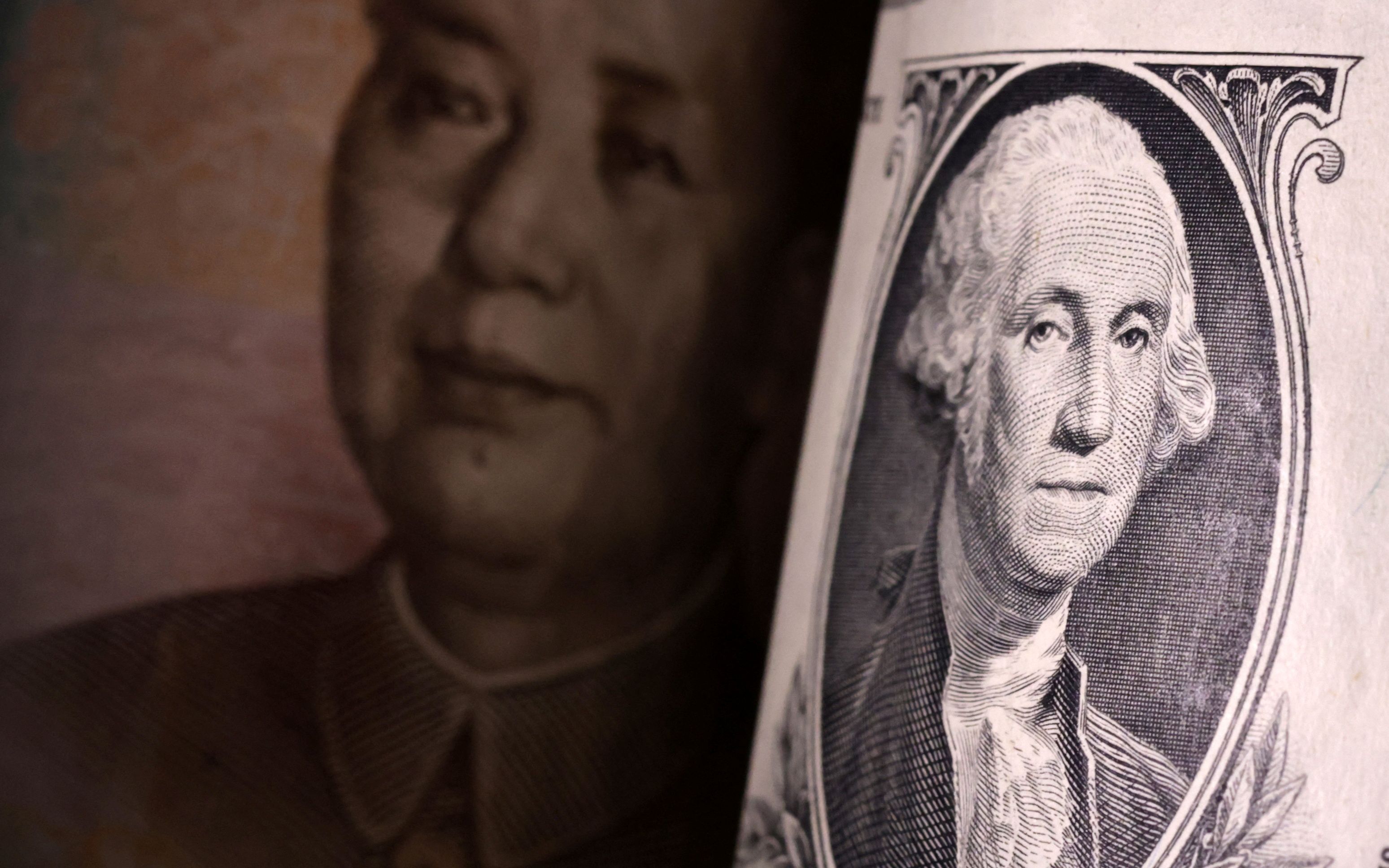 Illustration shows US dollar and Chinese Yuan banknotes