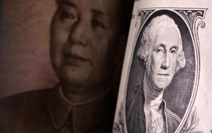 Illustration shows US dollar and Chinese Yuan banknotes
