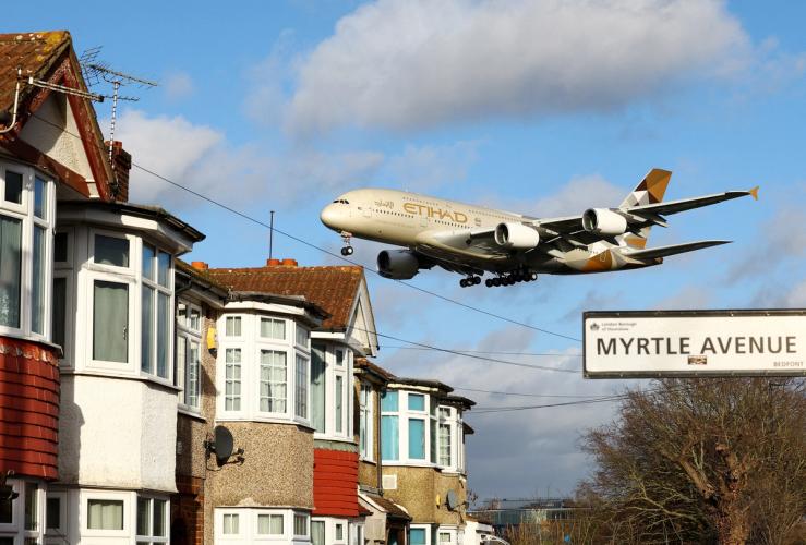 An Etihad Airways plane lands at Heathrow.