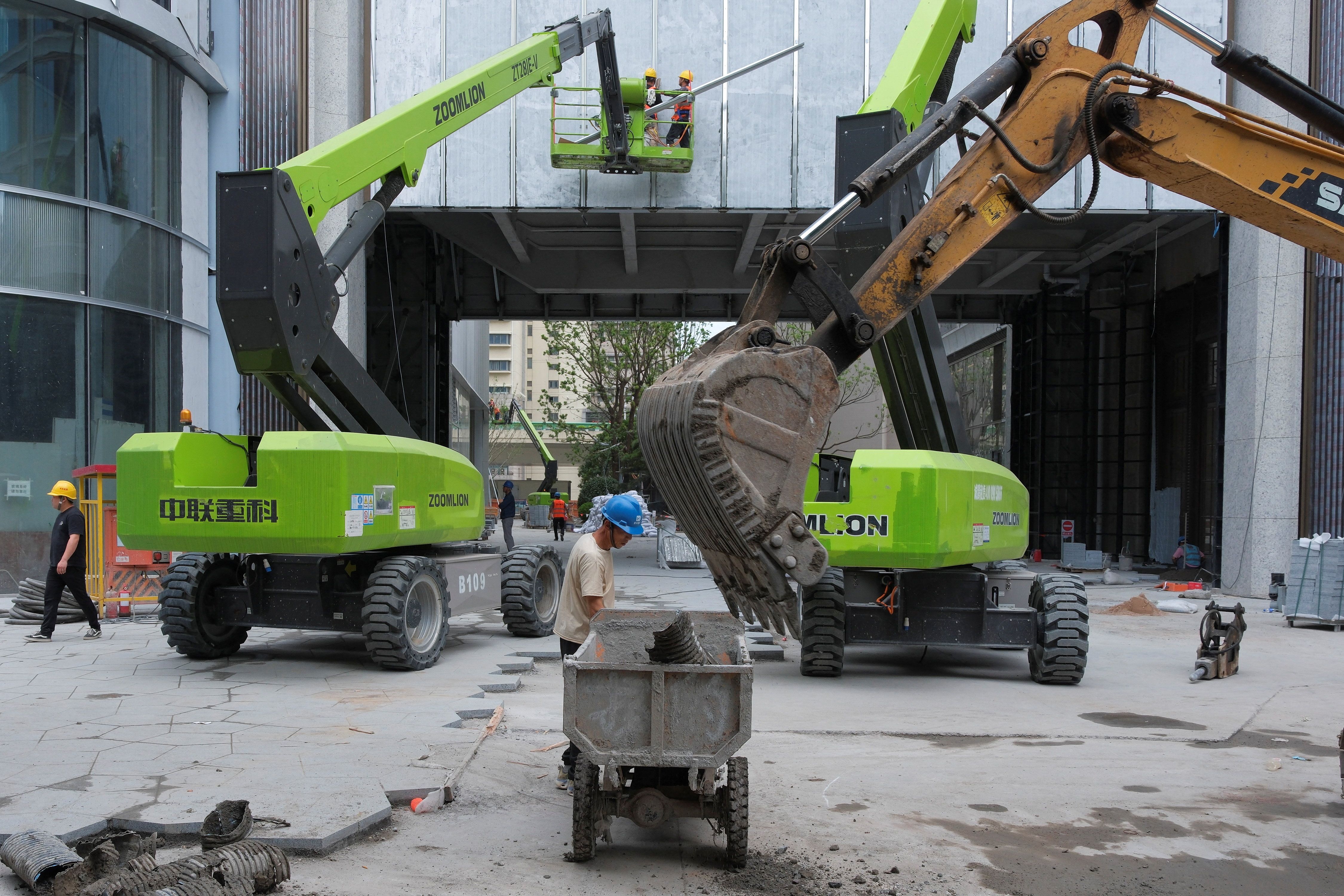 Construction workers at a building site in Shanghai, China. 