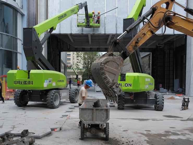 Construction workers at a building site in Shanghai, China.
