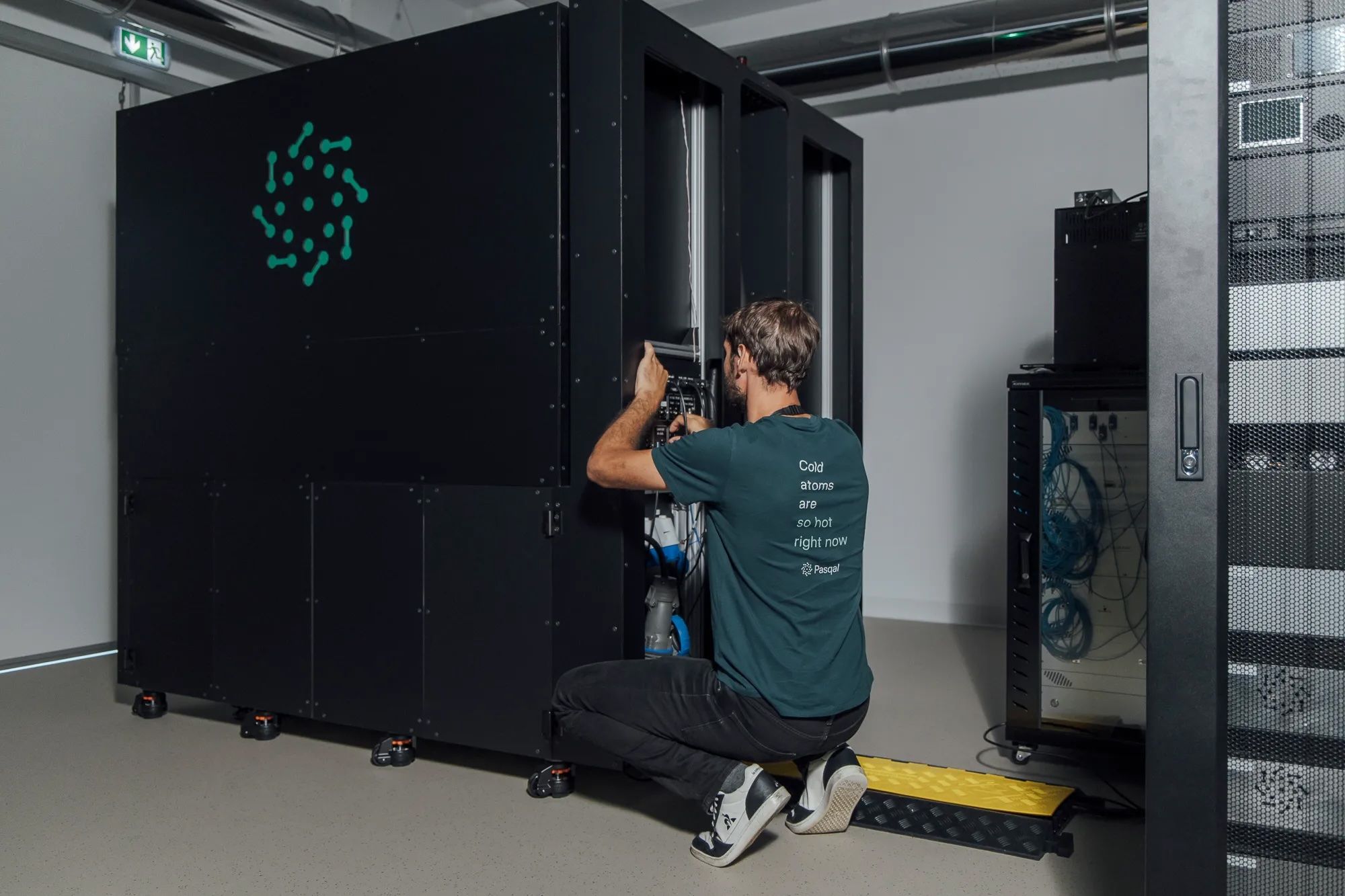 An engineer working on a Pasqal quantum processing unit.