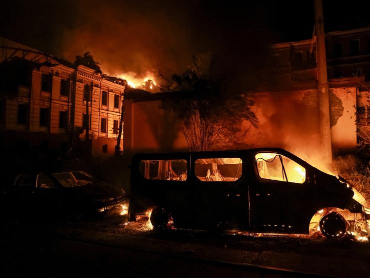 Smoke and fire rise at the site of a Russian missile strike in Kyiv