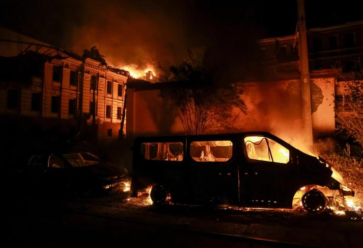 Smoke and fire rise at the site of a Russian missile strike in Kyiv