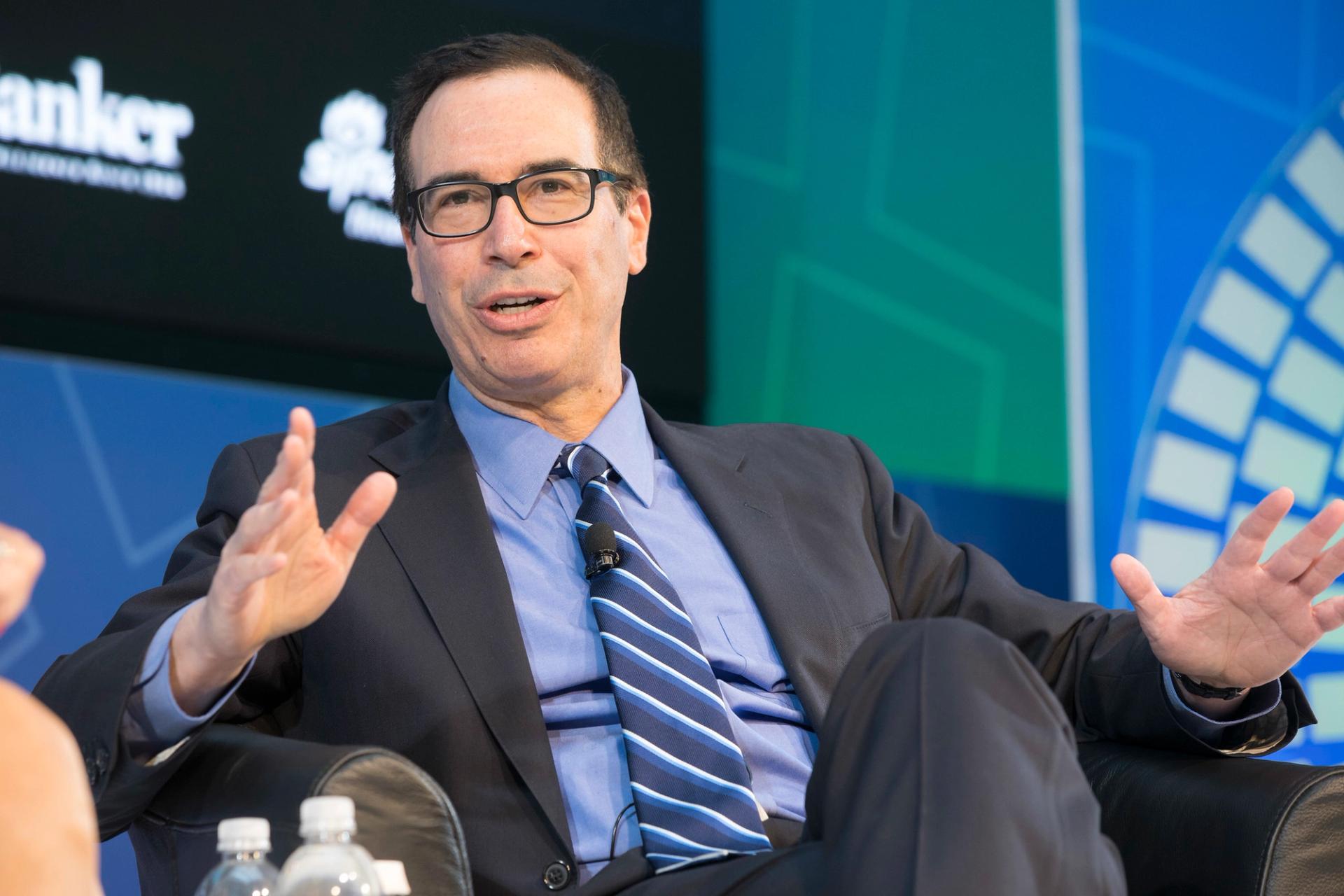 Then-US Treasury Secretary Steven Mnuchin (R) during a “Conversation on the US Economy” April 22, 2017 at the IMF Headquarters in Washington, DC.