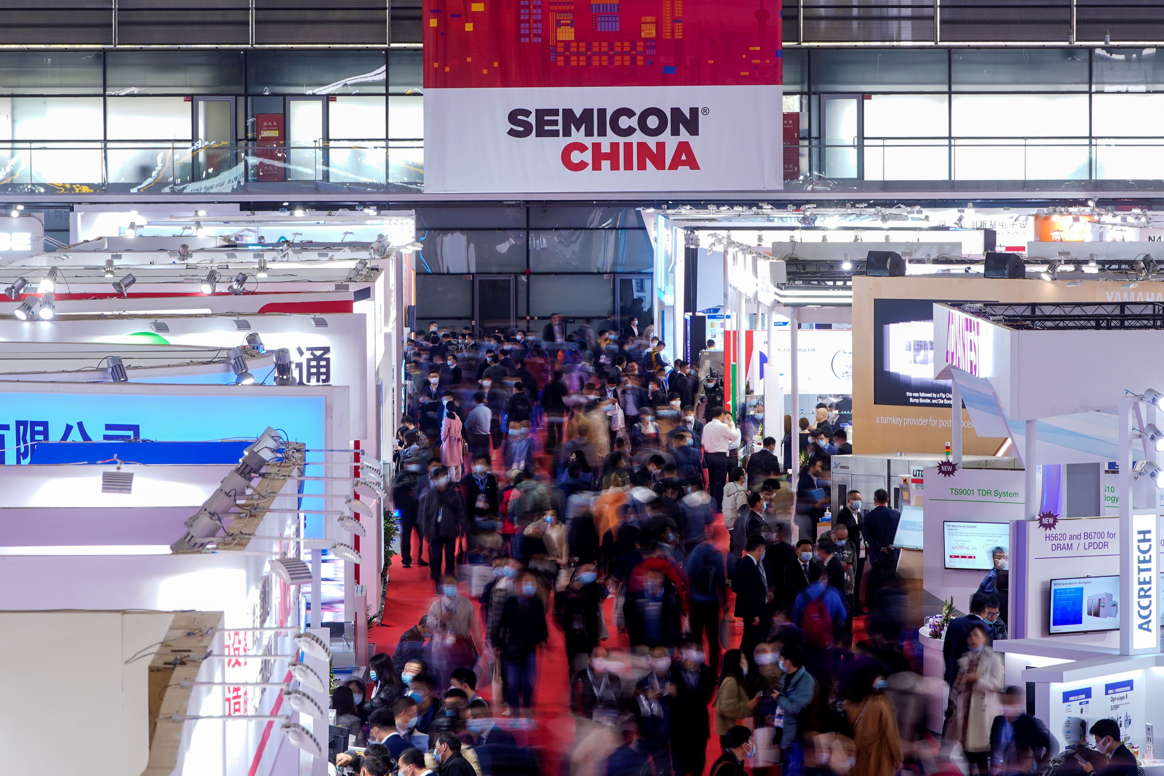 People visit Semicon China, a trade fair for semiconductor technology, in Shanghai.