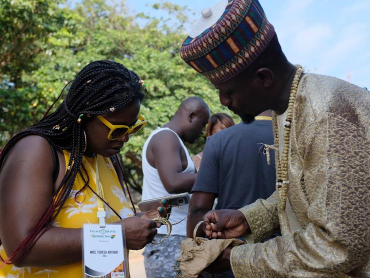 U.S. tourist Teresa Arthur looks at bracelets while on tour at the Kwame Nkrumah Mausoleum in Accra, Ghana.