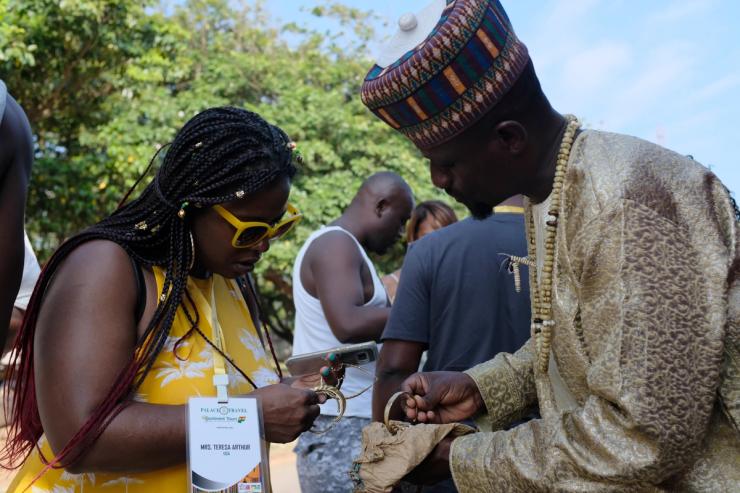 U.S. tourist Teresa Arthur looks at bracelets while on tour at the Kwame Nkrumah Mausoleum in Accra, Ghana.