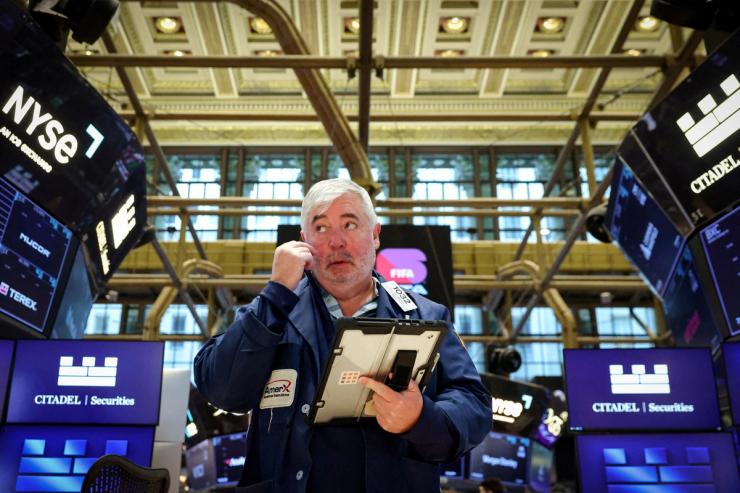 Traders work on the floor at the New York Stock Exchange (NYSE) in New York City, U.S., March 2, 2026.