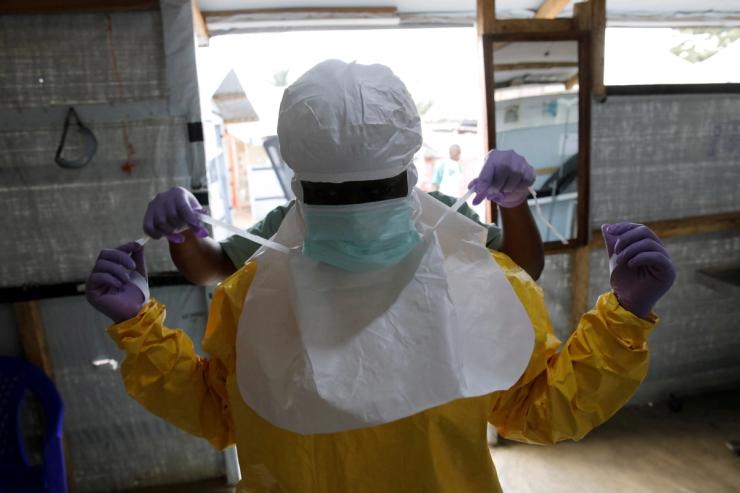 A health worker puts on Ebola protection gear in 2019.