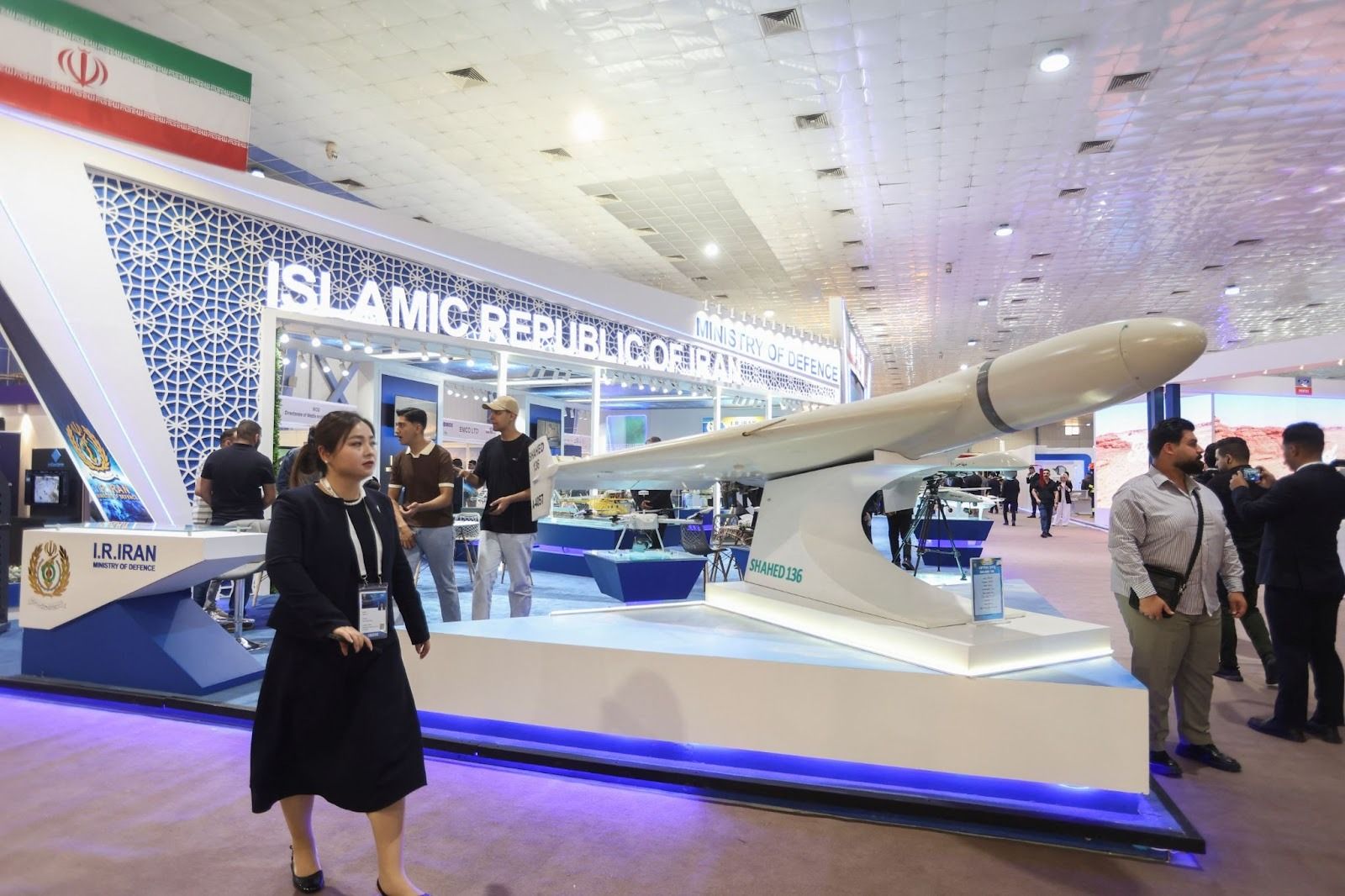 Visitors observe the Iranian Ministry of Defense’s display featuring the Shahed 136 drone during the 13th edition of Iraq’s Defense, Security.