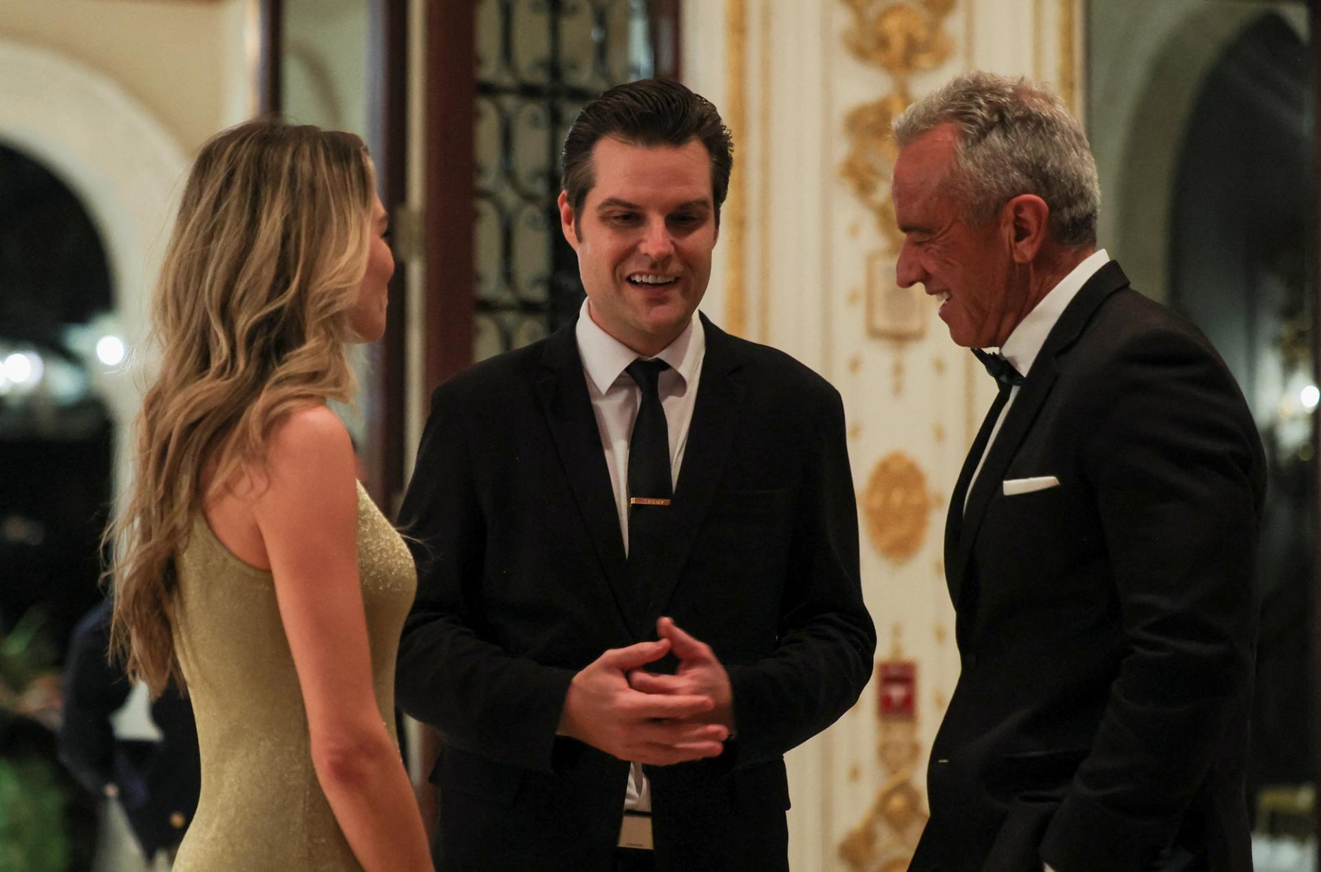 US President-elect Donald Trump’s nominee for Attorney General, Matt Gaetz, speaks with Trump’s nominee to lead the Department of Health and Human Services, Robert F. Kennedy Jr.