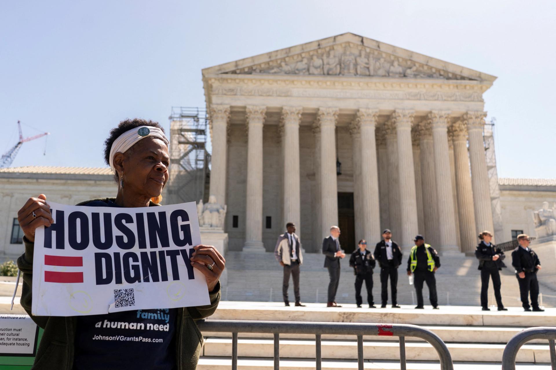 A homelessness activist demonstrates outside the U.S. Supreme Court on April 22, 2024.