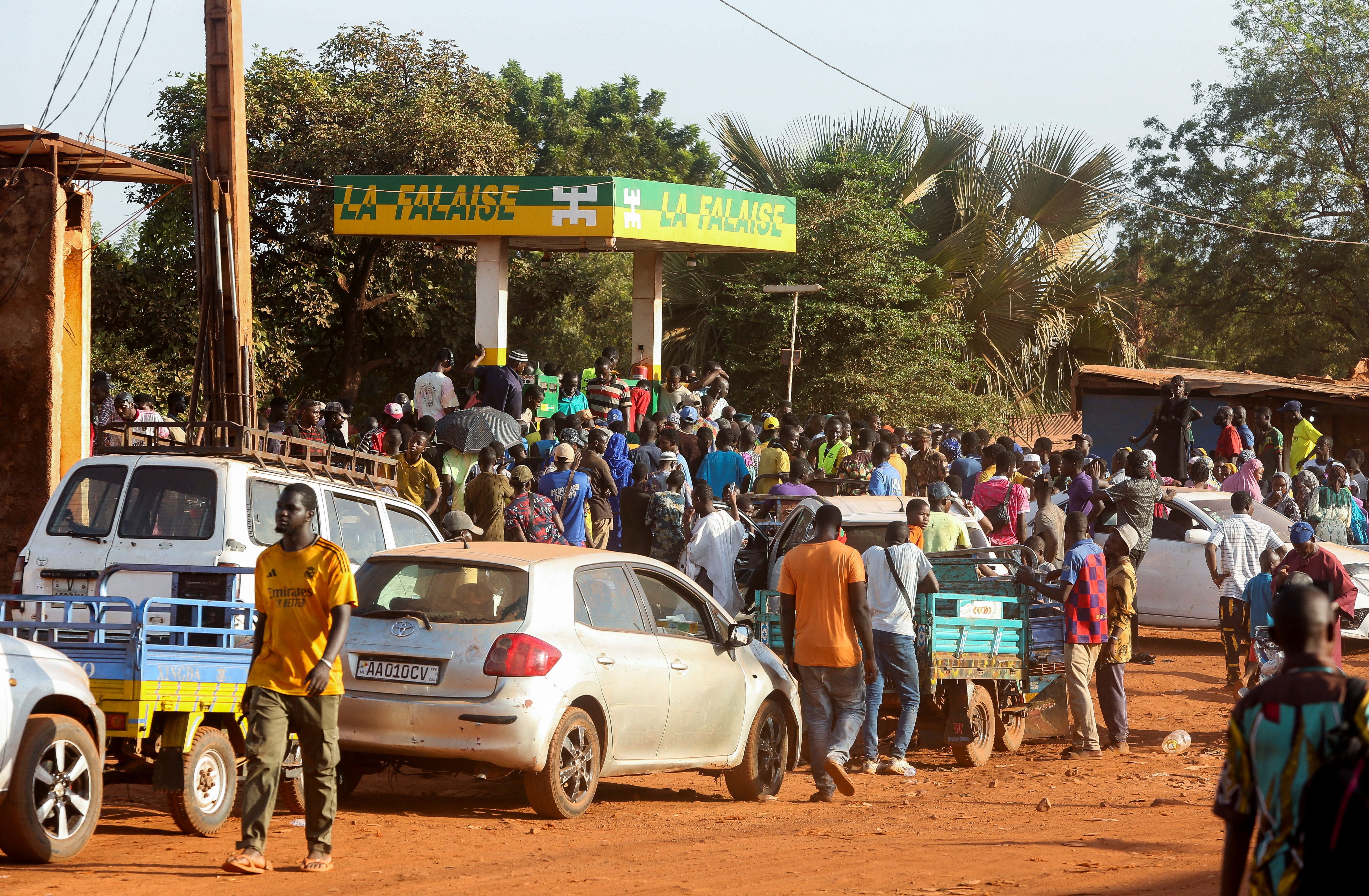 People gather at a petrol station in Bamako, Mali.